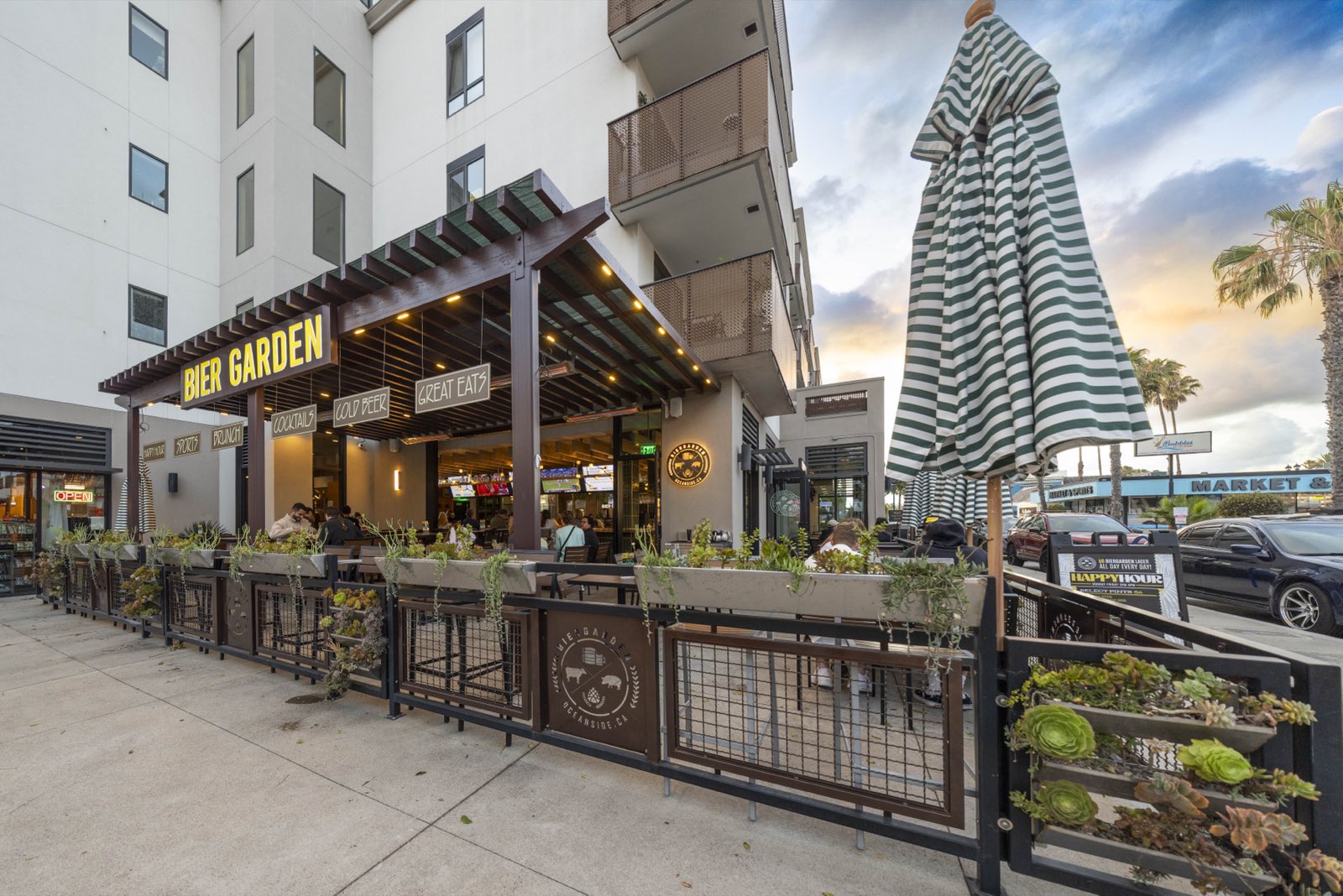 The downtown Oceanside storefront and patio at golden hour on North Cleveland Street