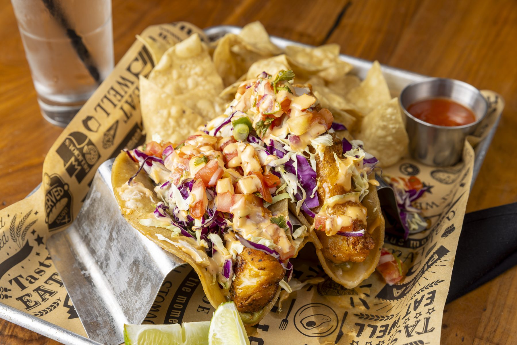 Baja-style street tacos with cabbage slaw and pico, served with tortilla chips and salsa