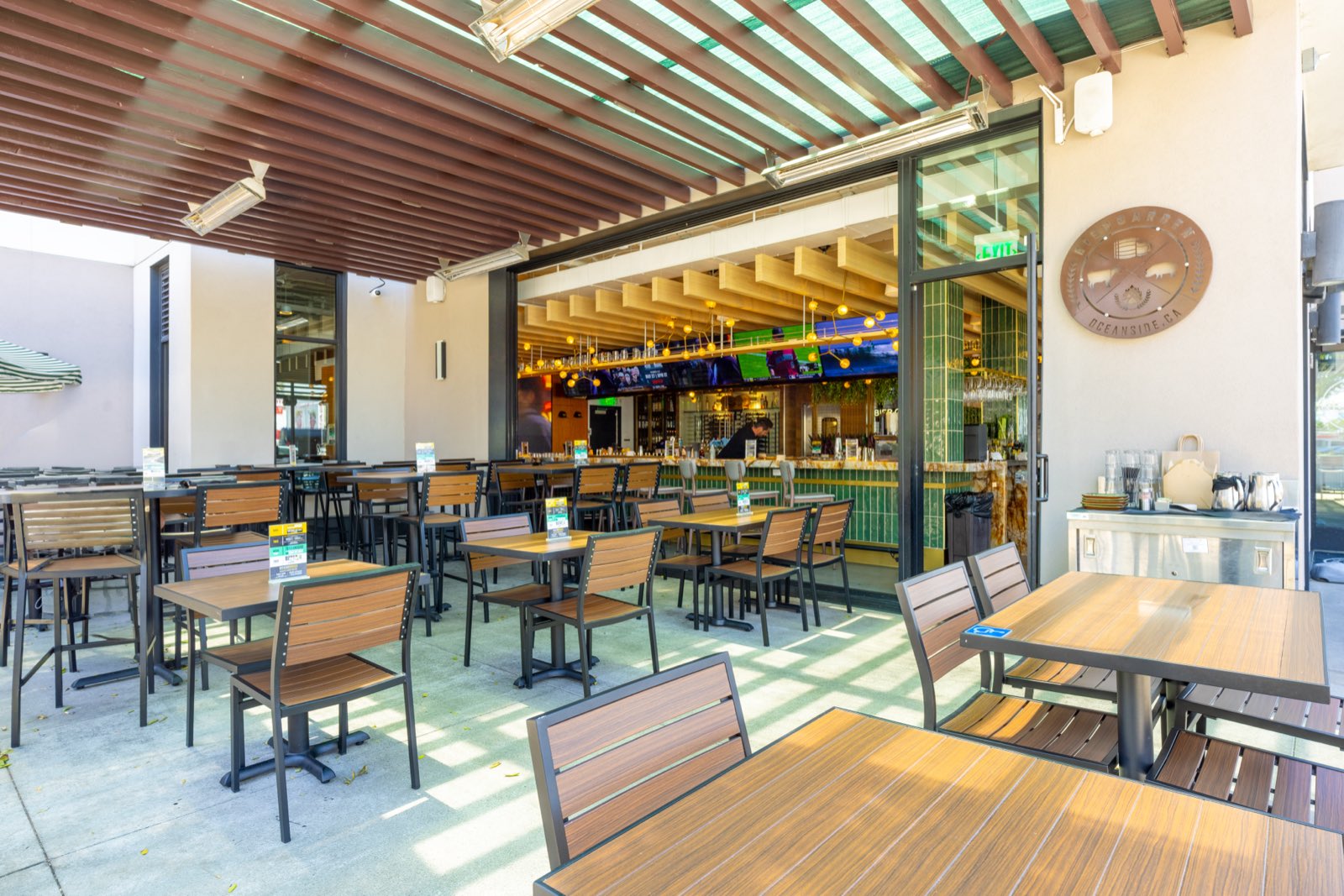 Covered patio dining tables under the pergola