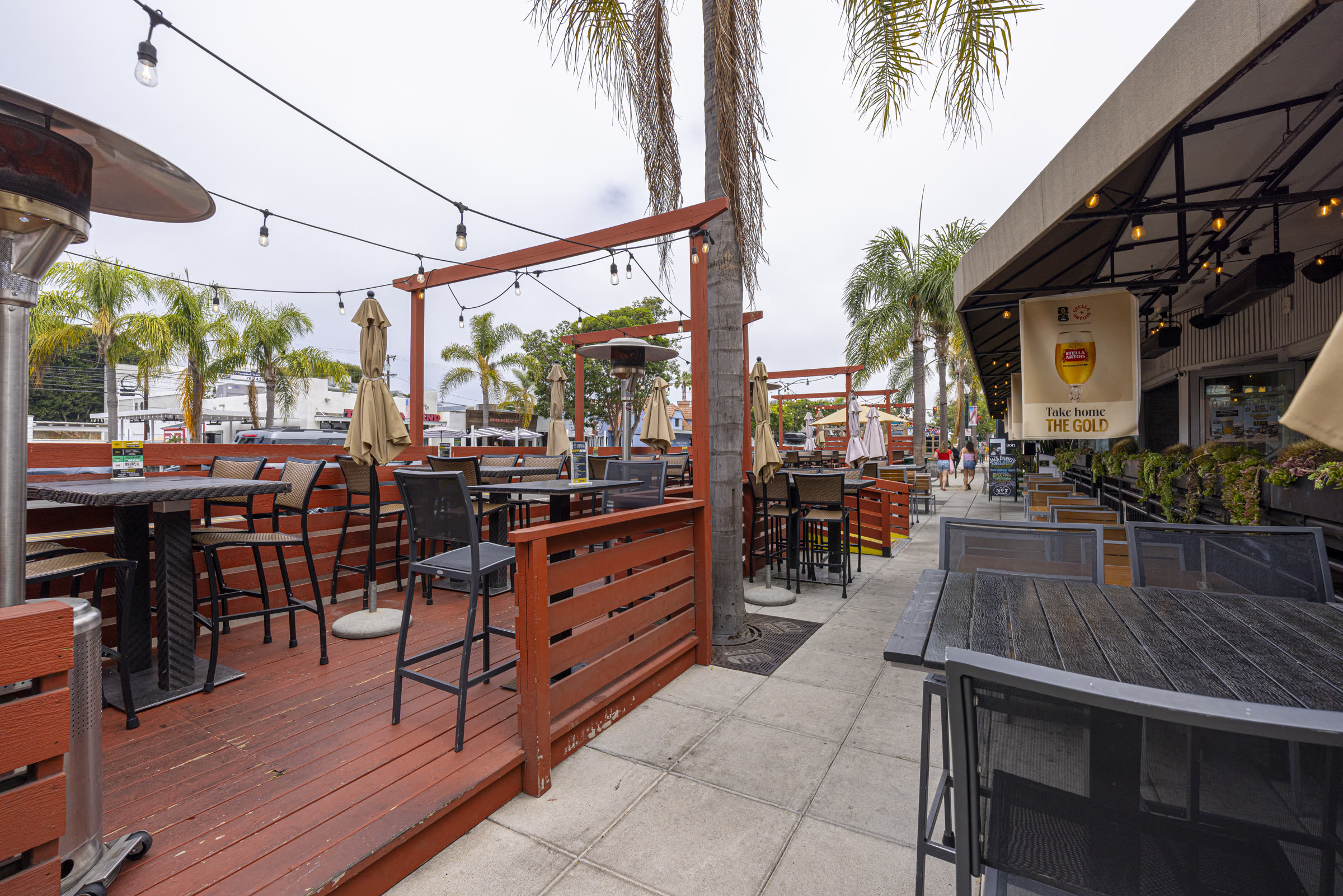 String-lit patio seating along the sidewalk in downtown Encinitas