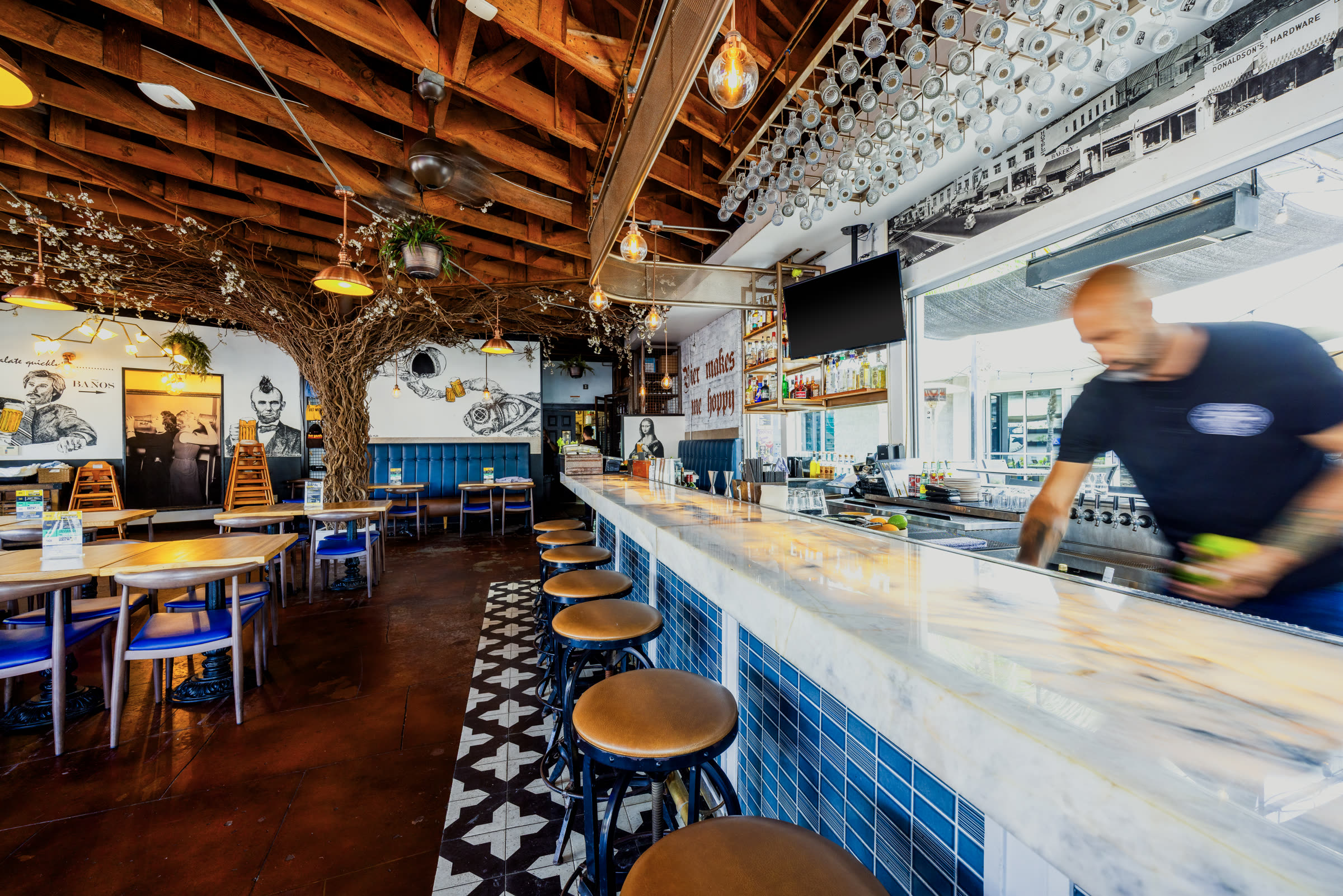 A bartender pouring a fresh drink at the Bier Garden Encinitas bar